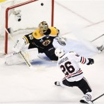 Chicago Blackhawks center Michal Handzus (26), of Slovakia, scores past Boston Bruins goalie Tuukka Rask (40), of Finland, during the first period in Game 4 of the NHL hockey Stanley Cup Finals, Wednesday, June 19, 2013, in Boston. (AP Photo/Charles Krupa)
