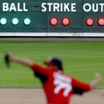 The scoreboard showing a full count is lit up as Boston Red Sox relief pitcher Anthony Carter winds up for a throw to St. Louis Cardinals' Ronny Cedeno during the eighth inning of a spring training baseball game, Tuesday, Feb. 26, 2013, in Fort Myers, Fla. (AP Photo/David Goldman)