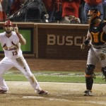 St. Louis Cardinals' Matt Carpenter reacts in front of San Francisco Giants catcher Hector Sanchez after scoring from second on a single by Matt Holliday during the fifth inning of Game 4 of baseball's National League championship series Thursday, Oct. 18, 2012, in St. Louis. (AP Photo/Mark Humphrey)