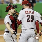 Arizona Diamondbacks catcher Miguel Montero, left, talks to relief 
pitcher Brad Ziegler (29) after Miami Marlins' Giancarlo Stanton hit an 
infield single in the ninth inning of a baseball game in Miami, 
Saturday, April, 28, 2012. The Marlins won 3-2. (AP Photo/Alan Diaz)