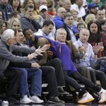  Phoenix Suns' Archie Goodwin (20) lands in the crowd after chasing a loose ball in the second quarter of an NBA basketball game against the Utah Jazz Wednesday, Feb. 26, 2014, in Salt Lake City. The Jazz won 109-86. (AP Photo/Rick Bowmer)