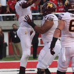 Arizona State's quarterback Taylor Kelly, left, jumps in the arms of Jamil Douglas after scoring in the fourth quarter during an NCAA college football game against Utah, Saturday, Nov. 9, 2013, in Salt Lake City. Arizona State won 20-19. (AP Photo/Rick Bowmer)
