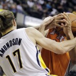 Indiana Pacers' Louis Amundson and Phoenix Suns' Robin Lopez battle for a loose ball during the first half of an NBA basketball game, Friday, March 23, 2012, in Indianapolis. (AP Photo/Darron Cummings)