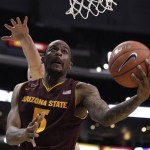 Arizona State's Kyle Cain, front, puts up a shot ahead of Stanford's Jack Trotter during the first half of an NCAA college basketball game at the Pac-12 Conference tournament in Los Angeles, Wednesday, March 7, 2012. (AP Photo/Jae C. Hong)