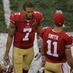 San Francisco 49ers quarterbacks Colin Kaepernick (7) and Alex Smith (11) talk on the sideline late in the fourth quarter of the NFL Super Bowl XLVII football game against the Baltimore Ravens, Sunday, Feb. 3, 2013, in New Orleans. (AP Photo/Charlie Riedel)