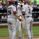 Arizona Diamondbacks' Paul Goldschmidt, center, is greeted by Miguel Montero, left, and Aaron Hill after hitting a two-run homer during the first inning of the baseball game against the New York Mets at Citi Field, Monday, July 1, 2013, in New York. (AP Photo/Seth Wenig)