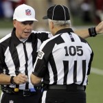 Referee Craig Ochoa, left, talks with field judge Rusty Spindel (105) 
during the first quarter of the NFL Hall of Fame exhibition football 
game between the Arizona Cardinals and New Orleans Saints, Sunday, 
Aug. 5, 2012 in Canton, Ohio. (AP Photo/Gene J. Puskar)
