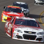 Driver Kevin Harvick (29) leads the field just ahead of Jeff Gordon (24) during the early stages of the AdvoCare 500 NASCAR Sprint Cup Series auto race at Phoenix International Raceway, Sunday, Nov. 10, 2013 in Avondale, Ariz. (AP Photo/Ralph Freso)