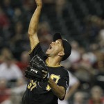 Pittsburgh Pirates' Juan Cruz signals an infield pop fly by Arizona Diamondbacks' Aaron Hill for the final out of the game during the ninth inning in an MLB baseball game Tuesday, April 17, 2012, in Phoenix. The Pirates defeated the Diamondbacks 5-4.(AP Photo/Ross D. Franklin)