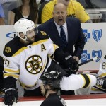 Boston Bruins head coach Claude Julien, center right, yells instructions as Bruins' Patrice Bergeron climbs over the boards in the first period of Game 1 in an NHL hockey Stanley Cup Eastern Conference finals against the Pittsburgh Penguins in Pittsburgh, Saturday, June 1, 2013. (AP Photo/Gene J. Puskar)