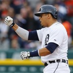 Detroit Tigers designated hitter Victor Martinez pumps his fist after hitting a run scoring double during the fourth inning of Game 3 of an American League baseball division series against the Oakland Athletics in Detroit, Monday, Oct. 7, 2013. (AP Photo/Paul Sancya)