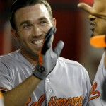 Baltimore Orioles shortstop J.J. Hardy (2) celebrates in the dugout after hitting a solo home run in the fifth inning during a baseball game against the Arizona Diamondbacks on Tuesday, Aug. 13, 2013, in Phoenix. (AP Photo/Rick Scuteri)