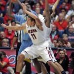  Southern University's Javan Mitchell (44) is double-teamed by Arizona's Aaron Gordon (11) and Brandon Ashley, back, in the first half of an NCAA college basketball game on Thursday, Dec. 19, 2013, in Tucson, Ariz. Arizona won 69-43. (AP Photo/John MIller)