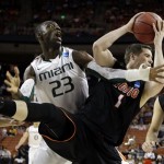 Pacific's Trevin Harris (1) grabs a rebound in front of Miami's Tonye Jekiri (23) nduring the first half of a second-round game of the NCAA college basketball tournament Friday, March 22, 2013, in Austin, Texas. (AP Photo/David J. Phillip)