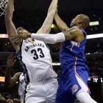 Memphis Grizzlies' Marc Gasol (33), of Spain, blocks a shot by Los Angeles Clippers' Caron Butler (5) during the first half of Game 6 in a first-round NBA basketball playoff series in Memphis, Tenn., Friday, May 3, 2013. (AP Photo/Danny Johnston)