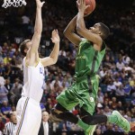 Oregon's Dominic Artis shoots against UCLA's David Wear in the first half of the NCAA college basketball game in the Pac-12 Conference tournament Saturday, March 16, 2013, in Las Vegas. (AP Photo/Julie Jacobson)
