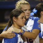 Florida's Megan Bush, right, hugs teammate Aja Paculba, left, after Florida lost a Women's College World Series championship series game 7-2 to Arizona State in Oklahoma City, Tuesday, June 7, 2011. It was Arizona's second victory in a best-of three series and they won the National Title. (AP Photo/Sue Ogrocki)