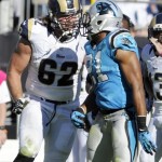 St. Louis Rams' Harvey Dahl (62) confronts Carolina Panthers' Mike Mitchell (21) in the second half of an NFL football game in Charlotte, N.C., Sunday, Oct. 20, 2013. Dahl was called for a personal foul on the play. (AP Photo/Mike McCarn)