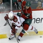  Minnesota Wild left wing Mike Rupp (27) checks Phoenix Coyotes defenseman David Schlemko (6) off the puck during the first period of an NHL hockey game in St. Paul, Minn., Wednesday, Nov. 27, 2013. (AP Photo/Ann Heisenfelt)