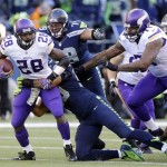 Seattle Seahawks' Red Bryant (79) pursues Minnesota Vikings' Adrian Peterson who is tackled on a carry in the first half of an NFL football game Sunday, Nov. 17, 2013, in Seattle. (AP Photo/Ted S. Warren)