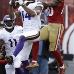 Minnesota Vikings wide receiver Joe Webb (14) catches a three-yard touchdown in front of San Francisco 49ers defensive back Perrish Cox (20) during the third quarter of an NFL preseason football game in San Francisco, Sunday, Aug. 25, 2013. (AP Photo/Ben Margot)