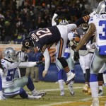 Chicago Bears quarterback Josh McCown (12) gets hit by Dallas Cowboys linebacker Sean Lee (50) in the air as McCown makes a touchdown run during the first half of an NFL football game, Monday, Dec. 9, 2013, in Chicago. (AP Photo/Nam Y. Huh)