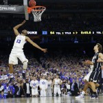 Duke's Matt Jones shoots against Gonzaga during the second half of a college basketball regional final game in the NCAA Tournament Sunday, March 29, 2015, in Houston. (AP Photo/Charlie Riedel)