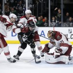 Los Angeles Kings center Nick Shore attempts to score past Arizona Coyotes goalie Mike Smith, right, as Arizona Coyotes defenseman Oliver Ekman-Larsson, left, and left wing Lauri Korpikoski, top center, defend during the second period of an NHL hockey game, Monday, March 16, 2015, in Los Angeles. (AP Photo/Danny Moloshok)