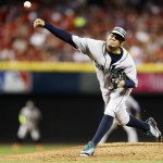 American League's Felix Hernandez, of the Seattle Mariners, throws during the third inning of the MLB All-Star baseball game, Tuesday, July 14, 2015, in Cincinnati. (AP Photo/Jeff Roberson)
