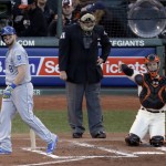 Kansas City Royals' Mike Moustakas walks off after striking out during the second inning of Game 5 of baseball's World Series against the San Francisco Giants on Sunday, Oct. 26, 2014, in San Francisco. (AP Photo/Charlie Riedel)
