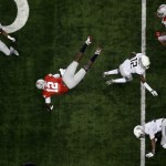 Ohio State's Cardale Jones (12) dives for a first down during the NCAA college football playoff championship game against Oregon Monday, Jan. 12, 2015, in Arlington, Texas. (AP Photo/Tony Gutierrez)