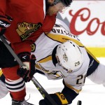Chicago Blackhawks center Brad Richards, left, and Nashville Predators center Paul Gaustad battle for the puck during the second period in Game 6 of an NHL Western Conference hockey playoff series Saturday, April 25, 2015, in Chicago. (AP Photo/Nam Y. Huh)
