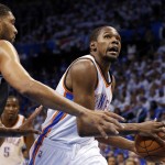  Oklahoma City Thunder forward Kevin Durant, right, drives past San Antonio Spurs forward Tim Duncan in the first quarter of Game 4 of the Western Conference finals NBA basketball playoff series in Oklahoma City, Tuesday, May 27, 2014. (AP Photo/Sue Ogrocki)