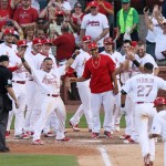 St. Louis Cardinals' Jhonny Peralta (27) is greeted by teammates at home plate after hitting a walk-off solo home run in the tenth inning during a game between the St. Louis Cardinals and the Arizona Diamondbacks on Monday, May 25, 2015, at Busch Stadium in St. Louis. (St. Louis Post-Dispatch via AP)