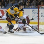 Buffalo Sabres center Tyler Ennis (63) scores against Arizona Coyotes defenseman Oliver Ekman-Larsson (23), of Sweden, during the first period of an NHL hockey game Thursday, March 26, 2015, in Buffalo, N.Y. Arizona won in overtime 4-3. (AP Photo/Gary Wiepert)