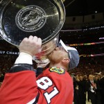 Chicago Blackhawks' Marian Hossa, of Slovakia, kisses the Stanley Cup Trophy after defeating the Tampa Bay Lightning in Game 6 of the NHL hockey Stanley Cup Final series on Monday, June 15, 2015, in Chicago. The Blackhawks defeated the Lightning 2-0 to win the series 4-2. (AP Photo/Nam Y. Huh)
