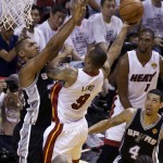 Miami Heat forward Rashard Lewis (9) goes to the basket against San Antonio Spurs forward Boris Diaw (33) in the first half in Game 3 of the NBA basketball finals, Tuesday, June 10, 2014, in Miami. (AP Photo/Lynne Sladky)