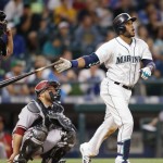 Seattle Mariners' Robinson Cano hits a solo home run on a pitch from Arizona Diamondbacks' Robbie Ray during the sixth inning of a baseball game on Monday, July 27, 2015, in Seattle. (AP Photo/John Froschauer)