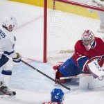 Montreal Canadiens' goalie Carey Price makes a save on Tampa Bay Lightning's Steven Stamkos during first period of the first round NHL Stanley Cup playoff hockey in Montreal, Sunday, April 20, 2014. (AP Photo/The Canadian Press, Graham Hughes)