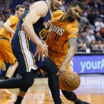 Phoenix Suns forward Markieff Morris (11) knocks away the ball from Utah Jazz forward Enes Kanter, of Turkey, during the first half of an NBA basketball game, Friday, Feb. 6, 2015, in Phoenix. (AP Photo/Matt York)