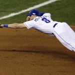 Kansas City Royals third baseman Mike Moustakas can't catch a double hit by San Francisco Giants' Hunter Pence during the fourth inning of Game 1 of baseball's World Series Tuesday, Oct. 21, 2014, in Kansas City, Mo. (AP Photo/Jeff Roberson)