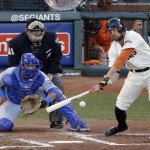San Francisco Giants' Hunter Pence hits a single during the second inning of Game 5 of baseball's World Series against the Kansas City Royals on Sunday, Oct. 26, 2014, in San Francisco. (AP Photo/Charlie Riedel)