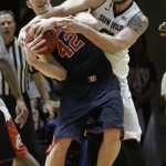 Utah forward Jakob Poeltl (42) battles for a loose ball with Arizona State forward Eric Jacobsen (21) in the first half of an NCAA college basketball game Thursday, Feb. 26, 2015, in Salt Lake City. (AP photo/Rick Bowmer)