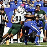 Kentucky wide receiver Dorian Baker, right, makes at catch in front of Ohio defender Ian Wells (41) at the goal line that was ruled a 8-yard touchdown completion in the first half of their NCAA college football game in Lexington, Ky., Saturday Sept. 6, 2014. (AP Photo/Garry Jones)