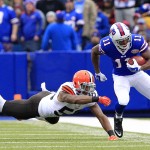 Buffalo Bills' Marcus Thigpen, right, avoids a tackle by Cleveland Browns inside linebacker Chris Kirksey during the first half of an NFL football game, Sunday, Nov. 30, 2014, in Orchard Park, N.J. (AP Photo/Bill Wippert)