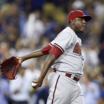 Arizona Diamondbacks starting pitcher Rubby De La Rosa reacts after Los Angeles Dodgers' Alex Guerrero hits a single to score Howie Kendrick during the fourth inning of a baseball game, Monday, June 8, 2015, in Los Angeles. (AP Photo/Danny Moloshok)