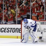 Tampa Bay Lightning goalie Ben Bishop pauses after giving up a goal to Chicago Blackhawks' Duncan Keith during the second period in Game 6 of the NHL hockey Stanley Cup Final series on Monday, June 15, 2015, in Chicago. (AP Photo/Nam Y. Huh)