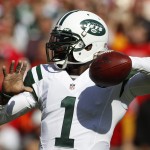 New York Jets quarterback Michael Vick (1) throws in the first half of an NFL football game against the Kansas City Chiefs in Kansas City, Mo., Sunday, Nov. 2, 2014. (AP Photo/Colin E. Braley)