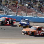 Chase Elliott (NAPA) spins between Ty Dillon (3) and Daniel Suarez in the 139th lap during the NASCAR Xfinity Series auto race on Saturday, March 14, 2015, in Avondale, Ariz. (AP Photo/Rick Scuteri)