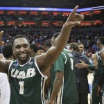 UAB guard Denzell Watts acknowledges the fans as he and his team celebrate their win over Iowa State in an NCAA tournament second round college basketball game in Louisville, Ky., Thursday, March 19, 2015. UAB won the game 60-59. (AP Photo/David Stephenson)